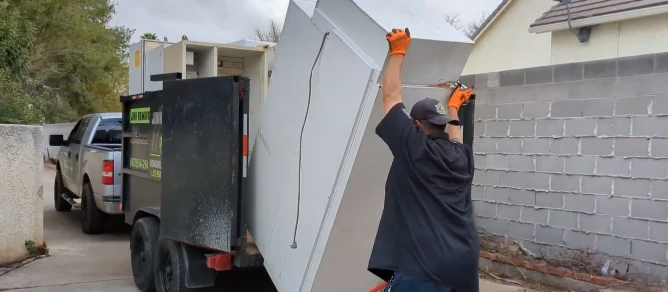 Appliance being carried out during a removal job in Hemet, CA