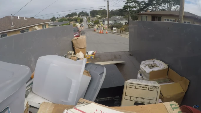 Boxes and household items loaded into a junk removal truck in Hemet, CA